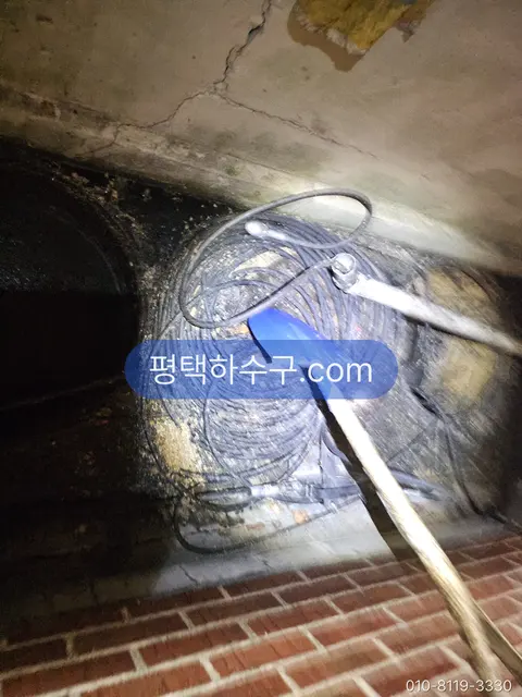 Clogged Drain / Sewer Line — Night call — clearing the blocked section inside the manhole with a cable