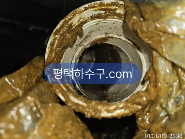Grease Trap Cleaning — Pipe cross-section narrowed by grease